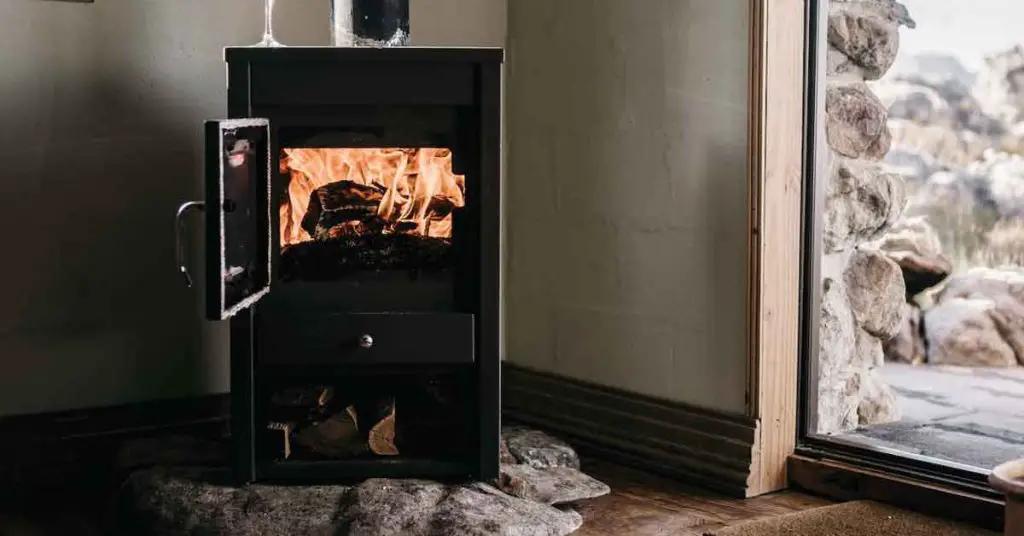 How to Heat Your Homestead with a Wood-Burning Stove - Featured Image