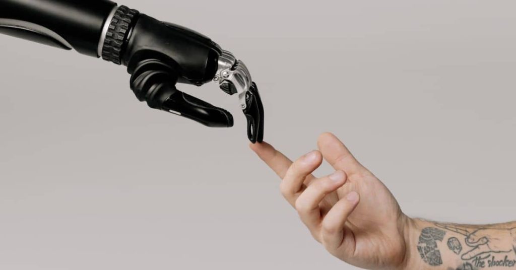 A robot and a human touching fingertips