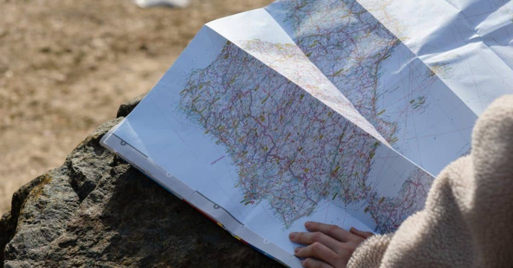 A woman looking at a roadmap